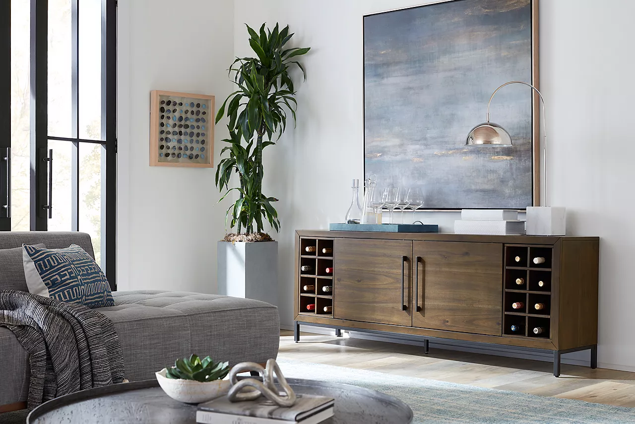 The Archer entertainment console in Macchiato with the  wine storage option added in a room scene.